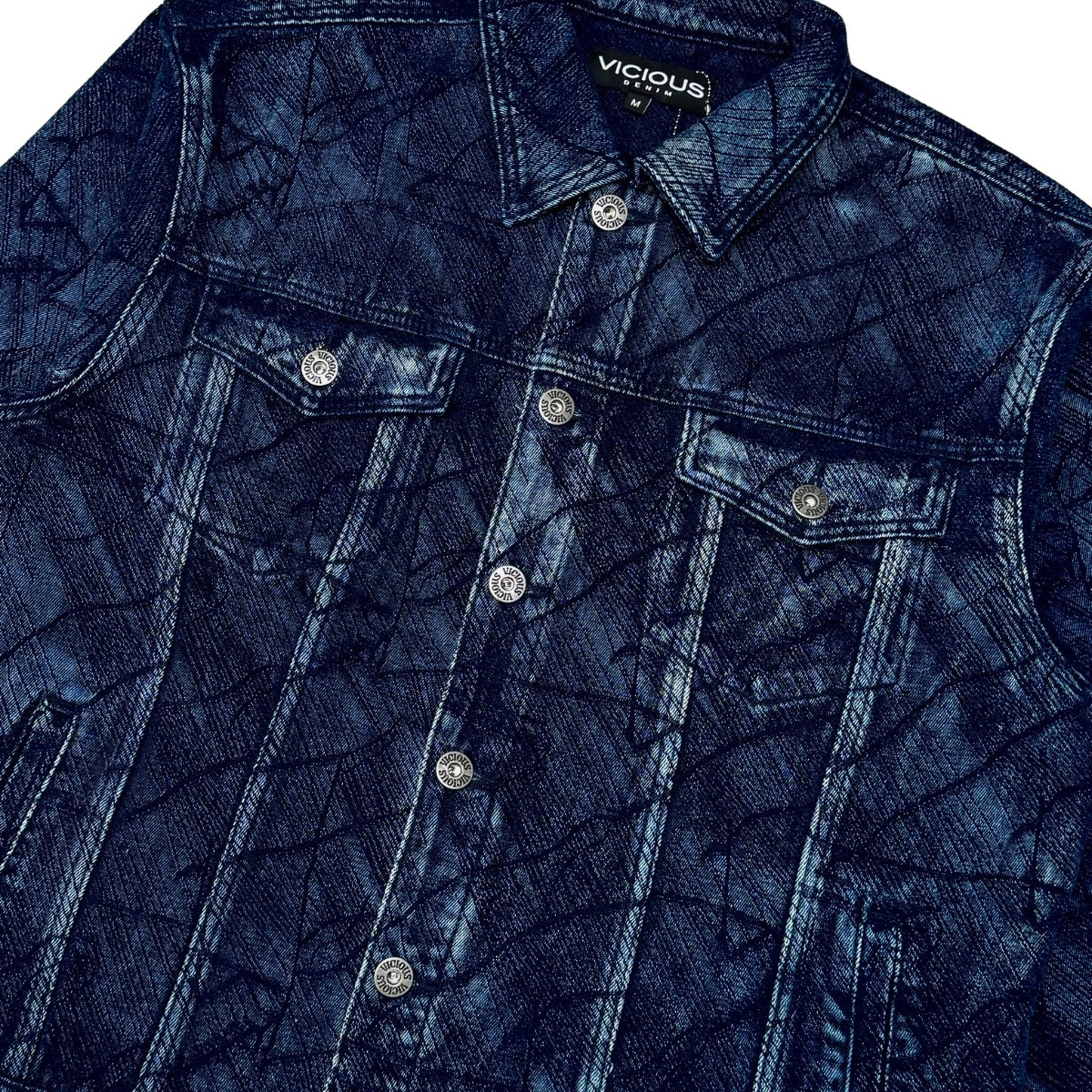 Vicious blue abstract denim jacket — pattern and pocket detail